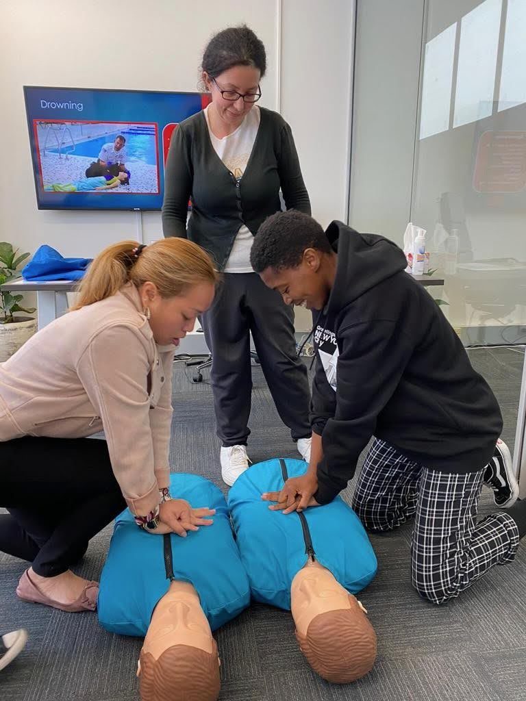Students practising CPR on training manikins